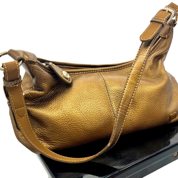 The Sak tobacco and golden sheen colored pebble leather in medium size shldr bag